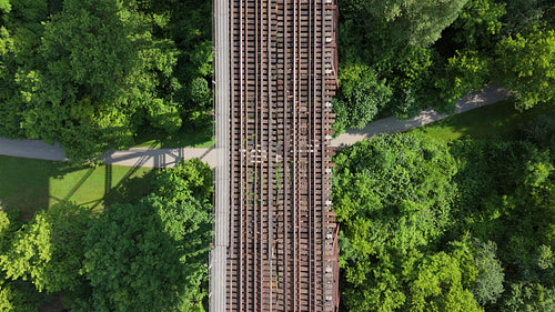 Drone following train tracks on top of trestle bridge. Toronto. 4K.