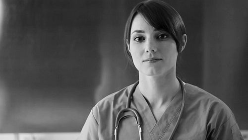 Female nurse portrait. Black and white. HD.