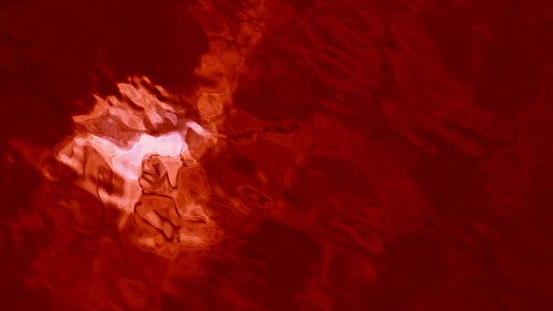 Blood lake. Slow motion ominous and spooky lake tinted blood red. Sky reflection. HD.