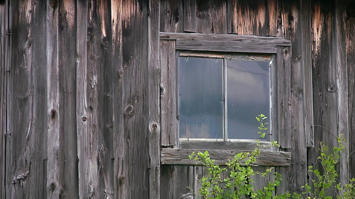 Detail of window in wooden shed. Rural Ontario, Canada. HD.