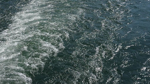 Slomo view of ferry wake in blue green turquoise water. Toronto, Canada. HD stock video.