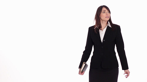 Lost female executive looking for something. Stop motion. White background. HD.