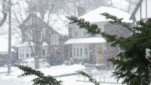 Slow motion snow falling in a suburb. Toronto, Canada. HD.