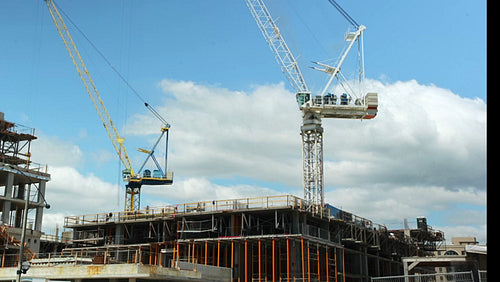 Two construction cranes. Wide shot. Time lapse. Toronto. No visible logos. HD.