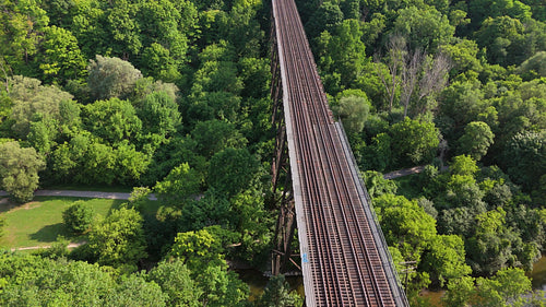 Drone shot of train bridge stock footage. E.T. Seton Park, Toronto, Canada. 4K.