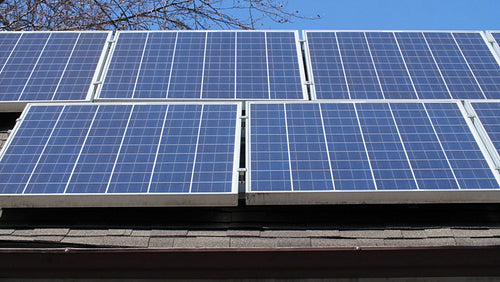 Solar panels on roof of suburban house or home. Toronto, Ontario, Canada. 4K.