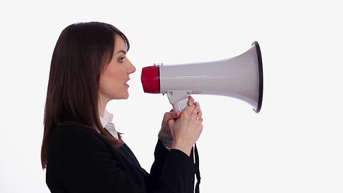 Female executive holds up megaphone and starts talking. Profile view. HD.