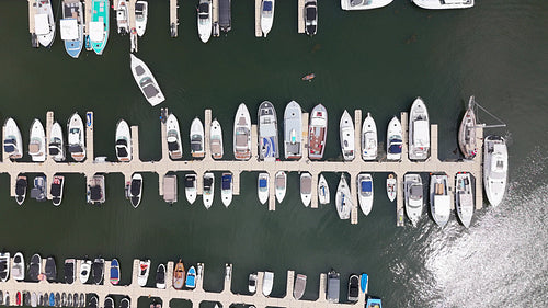 Slow drone shot moving over boats in marina. Charlottetown, PEI, Canada. 4K.