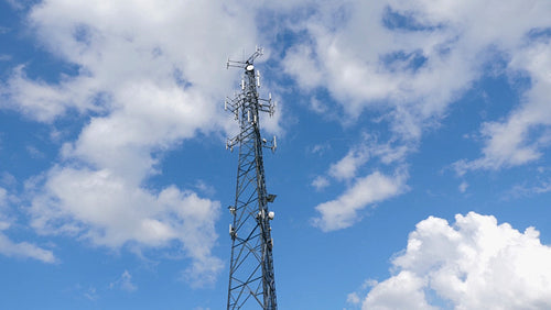 Communication tower with cellphone receivers and transmitters. 4K.