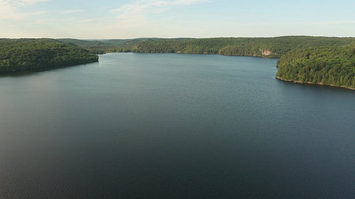 Drone aerial taking off over Drag Lake in Haliburton, Ontario, Canada. 4K video.