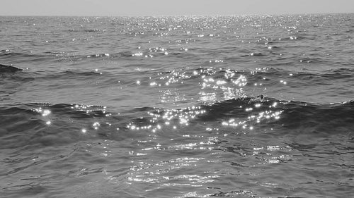 Beautiful slow motion cresting sunlit waves. Shore of Lake Ontario, Canada. Black and white. HD video.