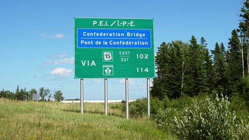 Highway sign for P.E.I. Confederation Bridge. Summer in New Brunswick, Canada. 4K.