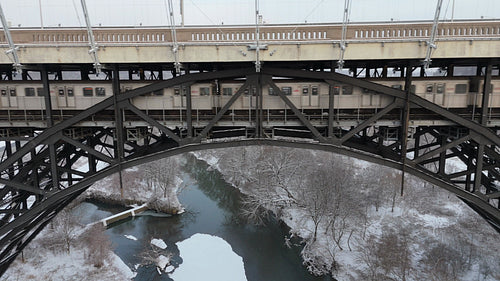 Drone aerial. Tracking TTC subway train. Bloor Viaduct. Winter, Toronto. 4K. Editorial Use only.