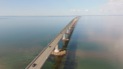 Orbiting drone aerial. Confederation Bridge linking New Brunswick and PEI. Summer. 4K.