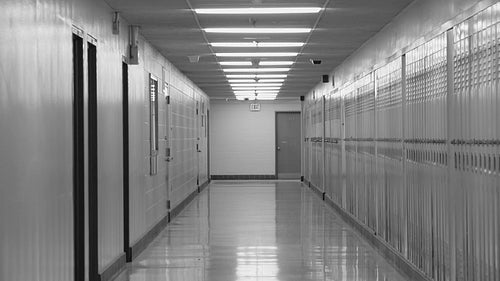 High school hallway. Zoom out. Toronto, Ontario, Canada. Black and white. HD video.