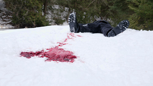 Guy dies lying in the snow with blood trail. Winter murder. Death. Crime. HD.