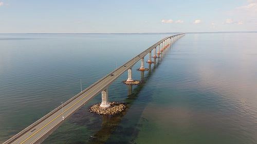 Orbiting drone aerial. Confederation Bridge linking New Brunswick and PEI. Summer. 4K.