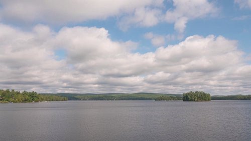 Time lapse of summer lake with beautiful clouds. Ontario, Canada. 4K.