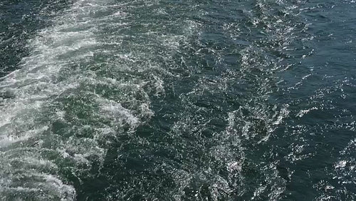 Slomo view of ferry wake in blue green turquoise water. Toronto, Canada. HD stock video.