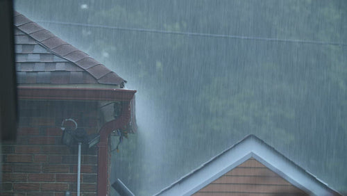 Detail of pouring rain on roofs of suburban neighborhood. Toronto. 4K.