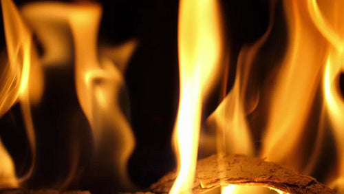 Slow motion yellow and orange flames. Closeup of flames with log. HD.