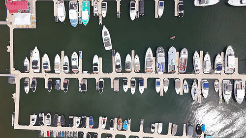 Slow drone shot moving over boats in marina. Charlottetown, PEI, Canada. 4K.
