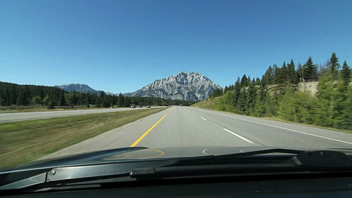 Driving towards a mountain on Trans Canada Hwy 1 in Alberta, Canada. HD.