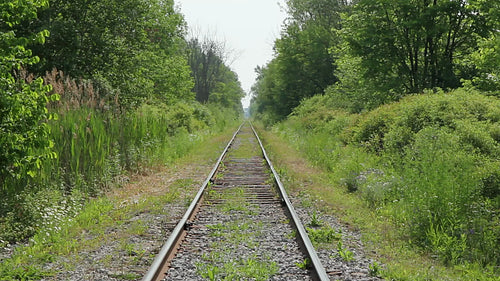 Train tracks in the countryside. Summer in Ontario, Canada. HD video.