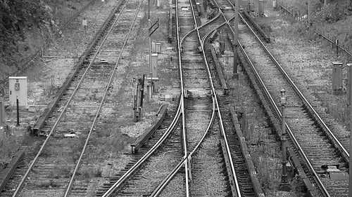 Multiple subway train tracks. No people, or trains. Toronto, Canada. Black & white. HD video.