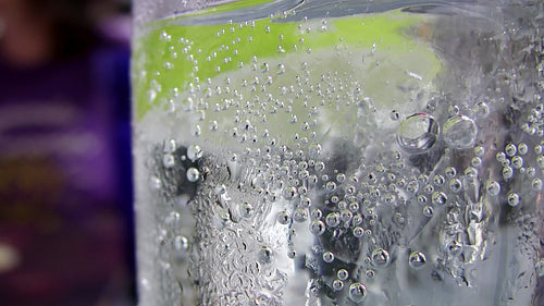 Sparkling water with lime slice. HDV footage. HD.
