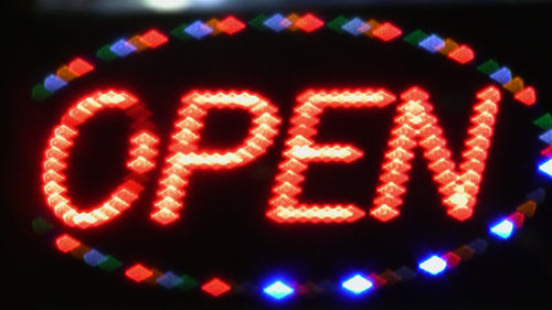 Open sign with flashing LED lights. Store advertising. Toronto, Canada. HD video.