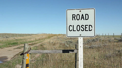 Road closed sign. Wide shot. Saskatchewan, Canada. HD.