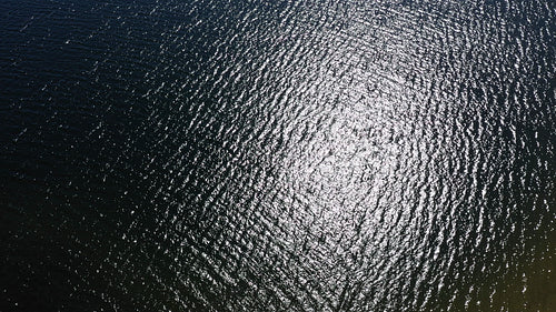 Birdseye, top down view of rippled surface of lake. Summer in Ontario. 4K.