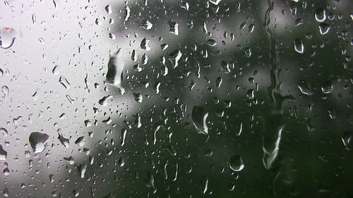 Rain drops on window during summer storm. HDV footage. HD.