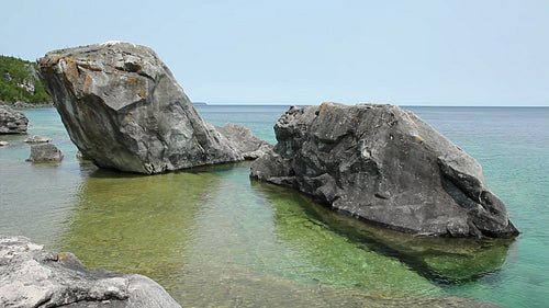 Big rocks in the waters of Georgian bay. HD.