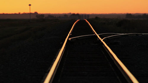 Train tracks at sunset with heat shimmer. SK, Canada. HD.