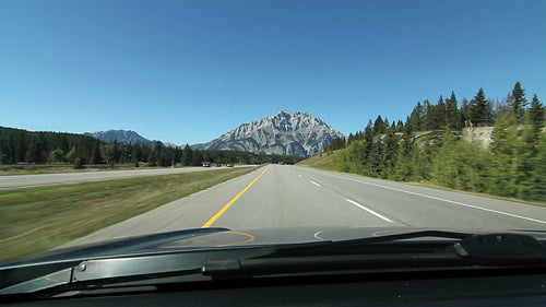 Driving towards a mountain on Trans Canada Hwy 1 in Alberta, Canada. HD.