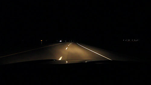 Driving at night on highway corner. Alberta, Canada. HD.