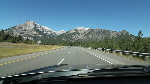 Driving through the mountains on Trans Canada Hwy 1 in Alberta, Canada. HD.