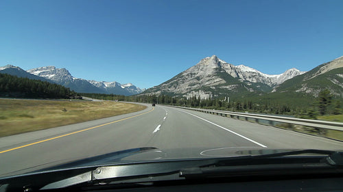 Driving through the mountains on Trans Canada Hwy 1 in Alberta, Canada. HD.