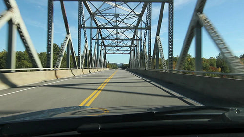 Driving across a truss bridge. Northern Ontario, Canada. HD.