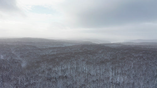 Drone flight descent over winter landscape. Beautiful light. 4K.