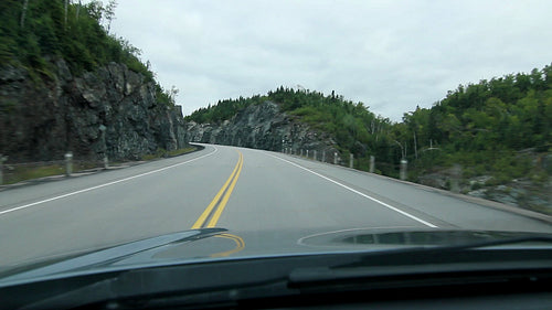 Driving through a rockcut. Ontario, Canada. HD.