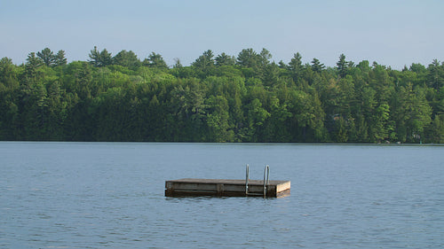 Summer swimming platform. Cottage country in Muskoka, Ontario, Canada. 4K.