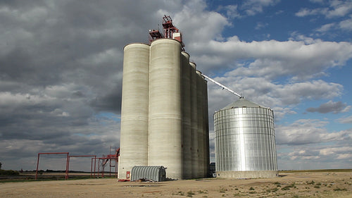 Grain elevator with dramatic clouds. Saskatchewan, Canada. HD.